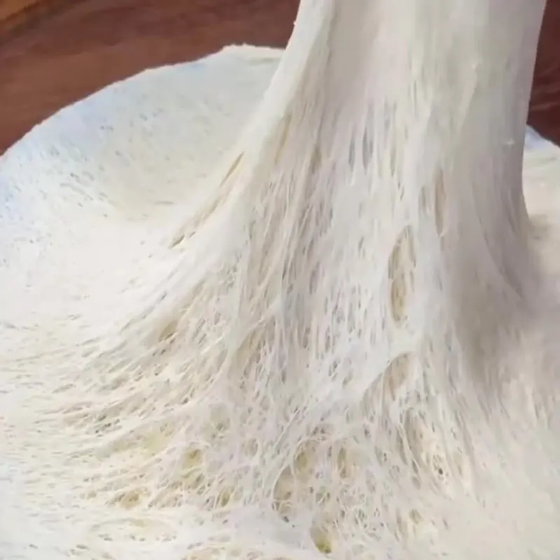Aluminum-free baking powder used in stretchy dough showing strong gluten network and clean-label leavening performance for safe baking