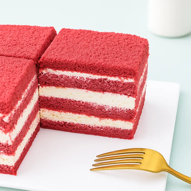 Red velvet layered sponge cake with fluffy cream filling and vibrant texture, showcasing excellent rise and no collapse after cooling—ideal for premium bakery products