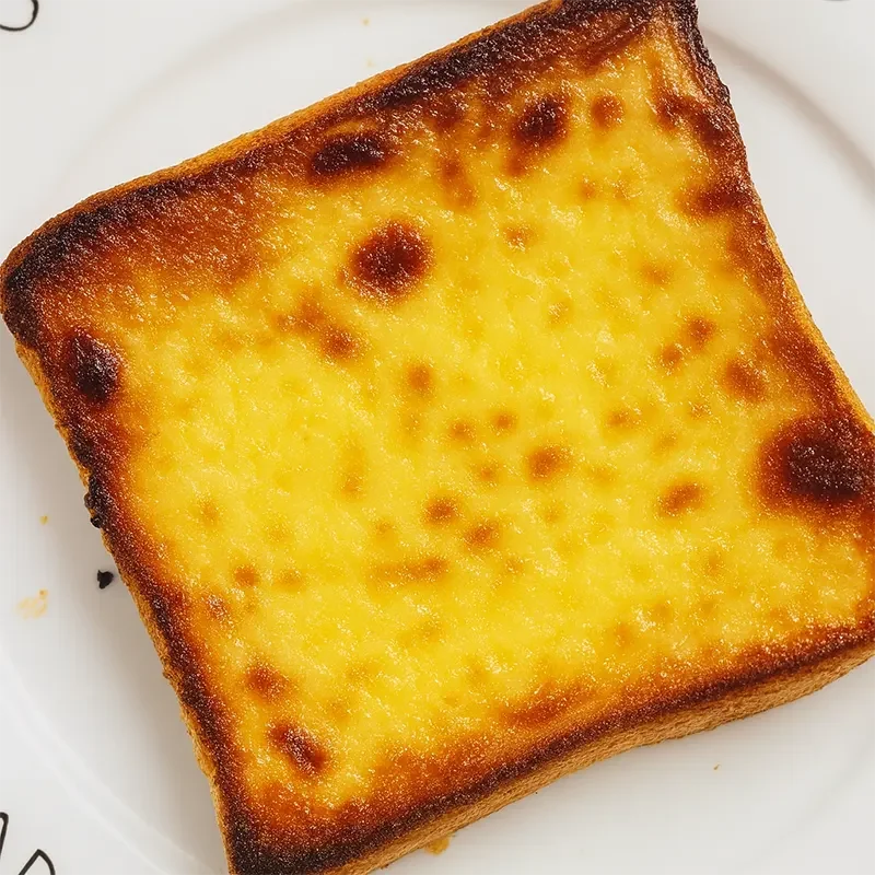 Golden baked custard toast with caramelized top—perfect use of custard powder for rich, creamy breakfast or dessert lovers