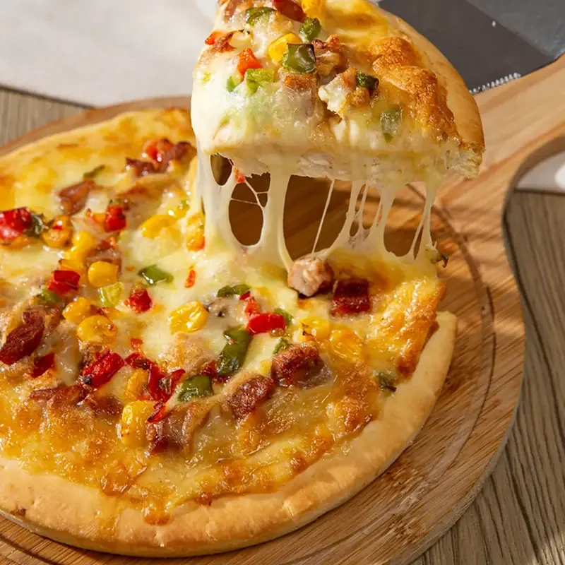 Freshly baked homemade pizza topped with melted cheese, vegetables, and sausage, made with instant dry yeast for a soft and airy crust.